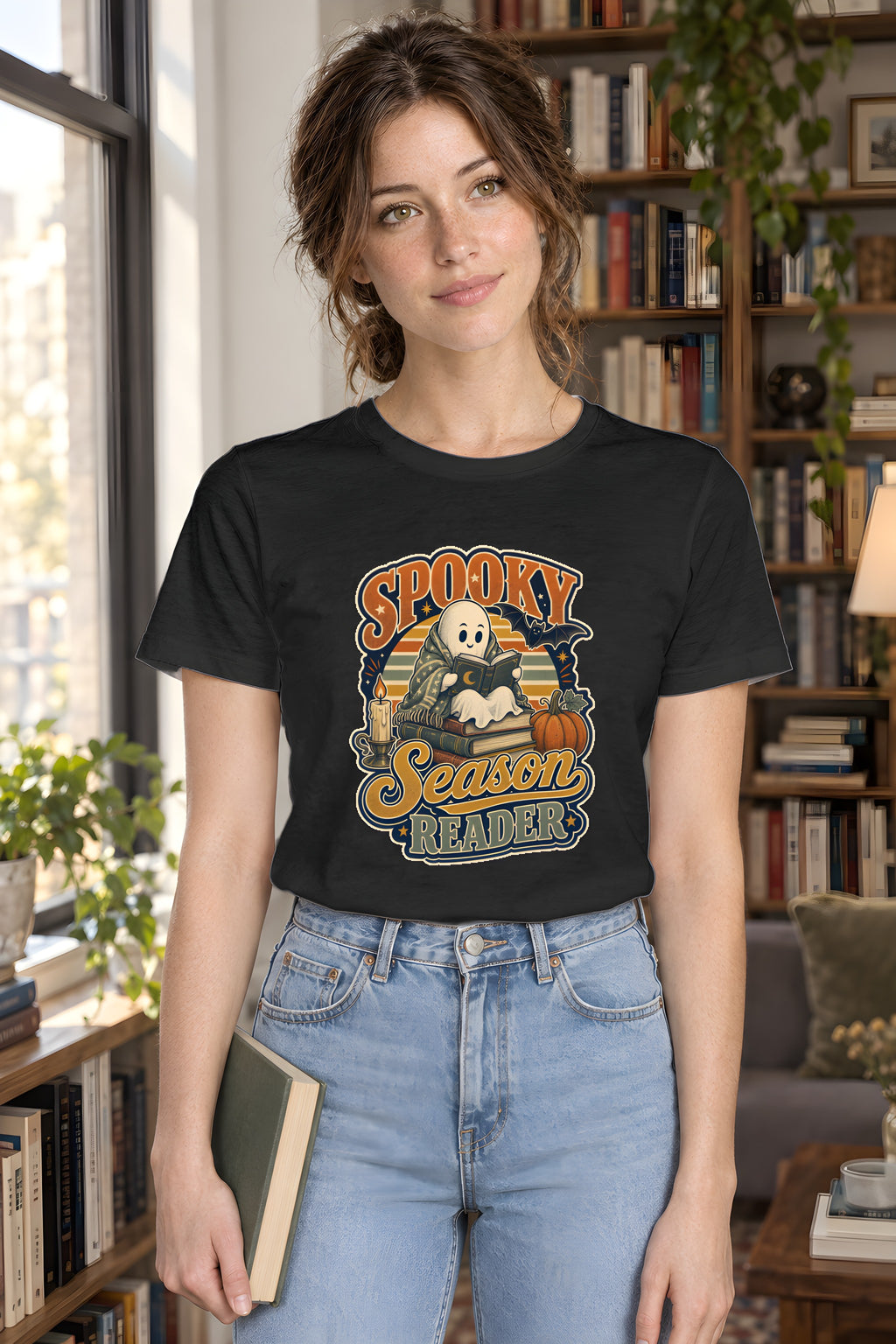 Spooky Season Reader T-Shirt, Cozy Fall Gift for Book Lovers – Black t-shirt worn by Lily