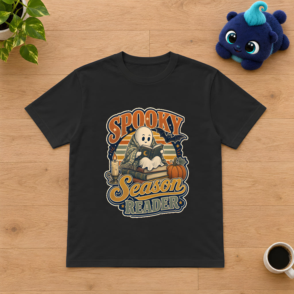Spooky Season Reader T-Shirt, Cozy Fall Gift for Book Lovers – Black t-shirt styled with Plip